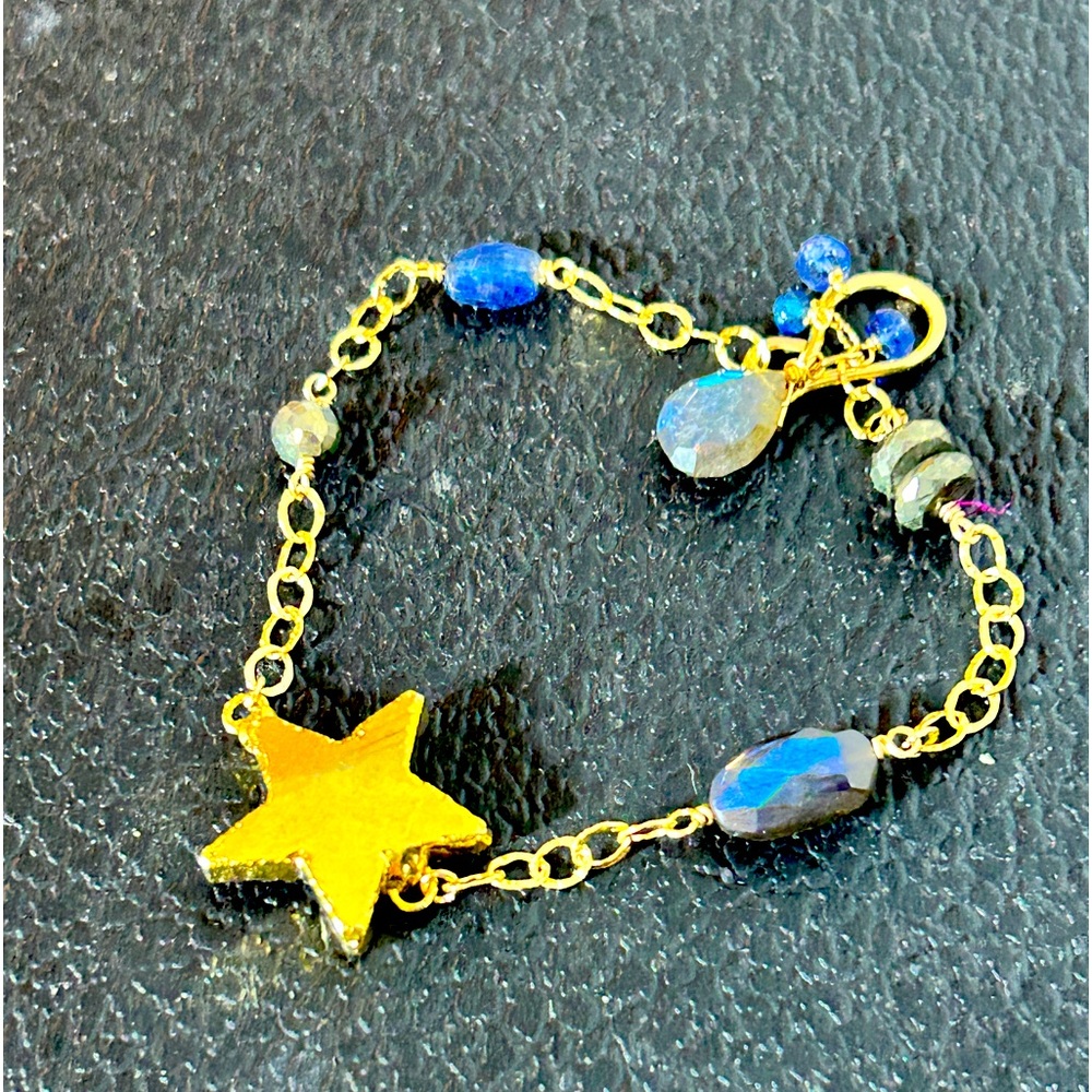 This is an antique silver with gold and blue stones bracelet. New